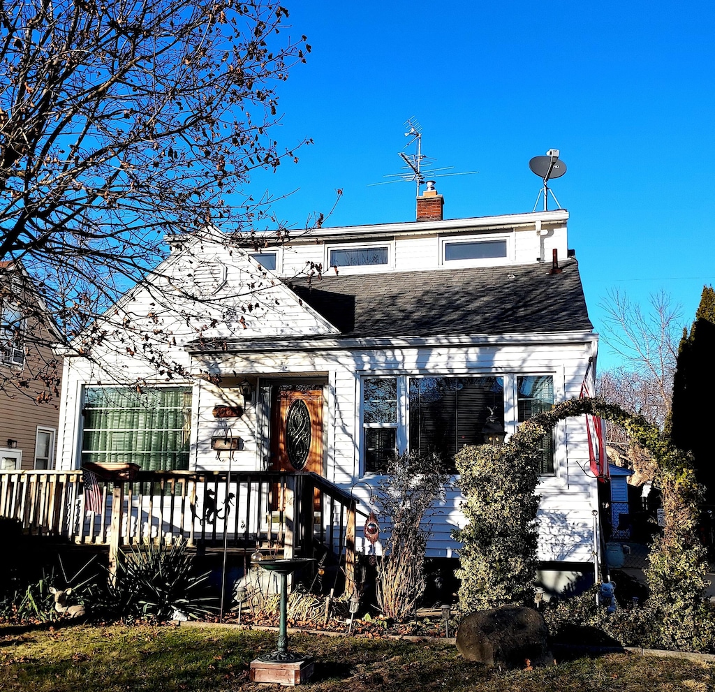 back of property featuring a deck