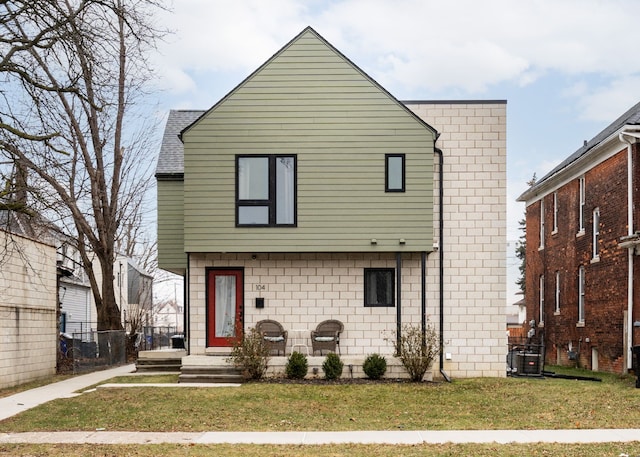 exterior space featuring a yard and cooling unit