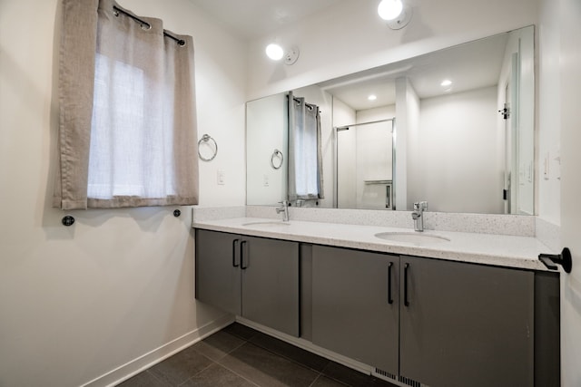 bathroom with tile patterned flooring and vanity