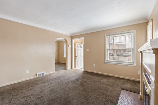 interior space featuring dark carpet