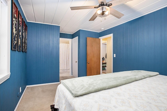 bedroom with carpet, ceiling fan, and crown molding