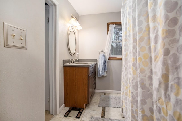 bathroom with curtained shower and vanity