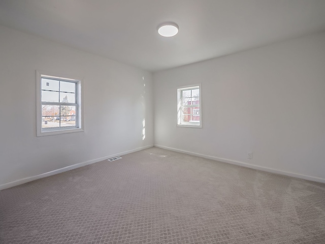 empty room featuring carpet floors