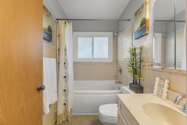 full bathroom with vanity, toilet, tile walls, and shower / tub combo with curtain