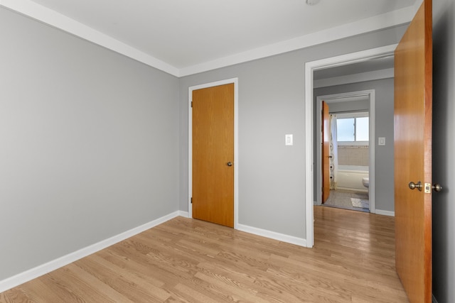 unfurnished bedroom with light wood-type flooring