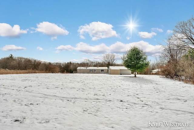 view of yard layered in snow