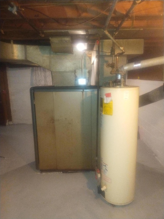 utility room with water heater