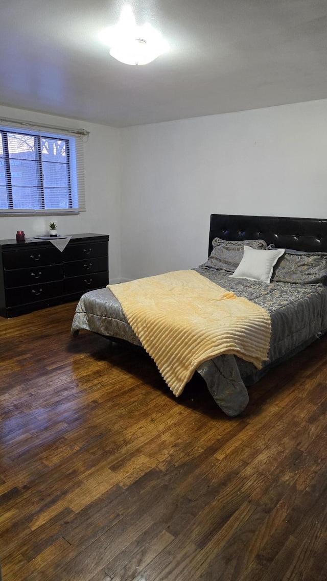 bedroom featuring wood finished floors