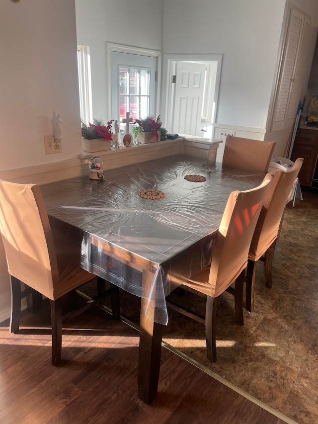 dining space with dark hardwood / wood-style floors