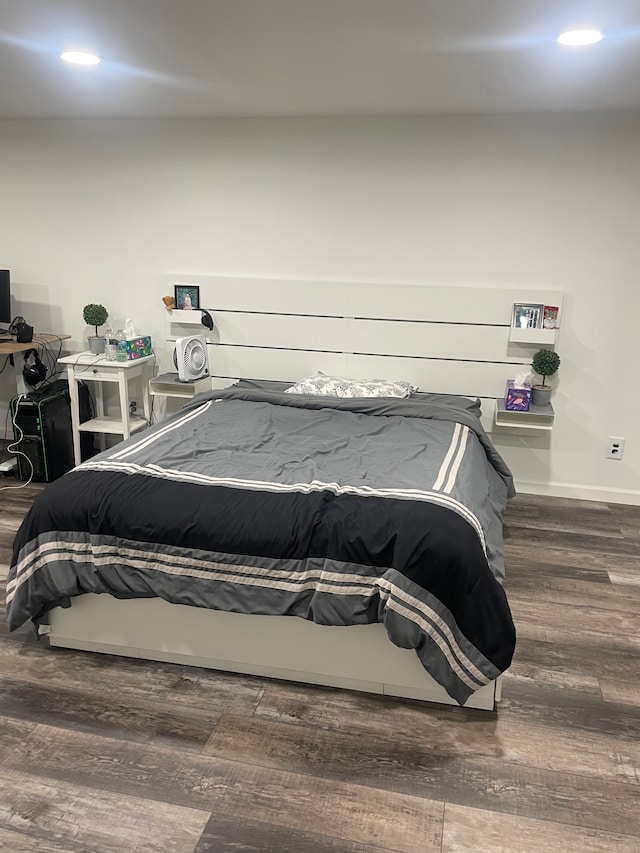 bedroom featuring dark hardwood / wood-style flooring