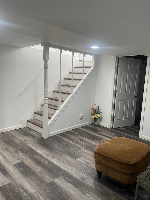 basement with dark wood-type flooring