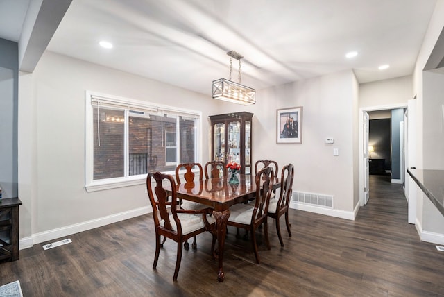 dining space featuring dark hardwood / wood-style flooring