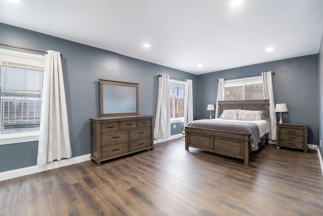 bedroom with dark wood-type flooring