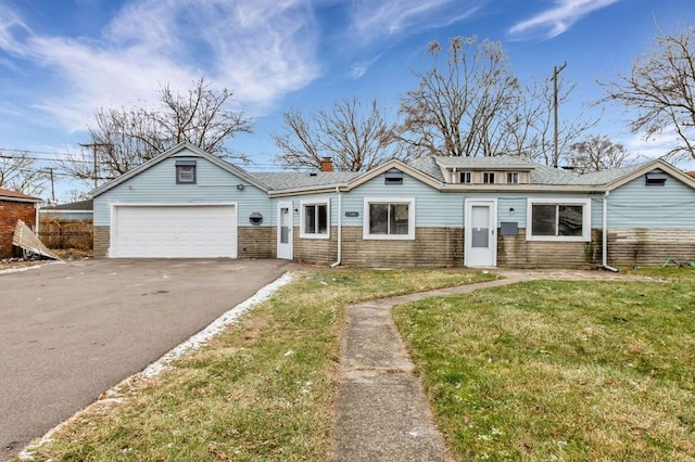 view of front facade with a garage and a front yard