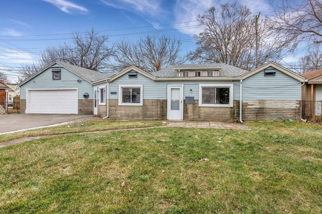 view of front of property with a front lawn and a garage