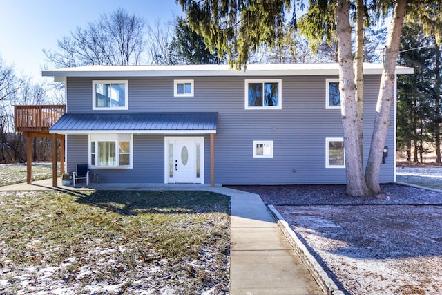 front of property with a wooden deck