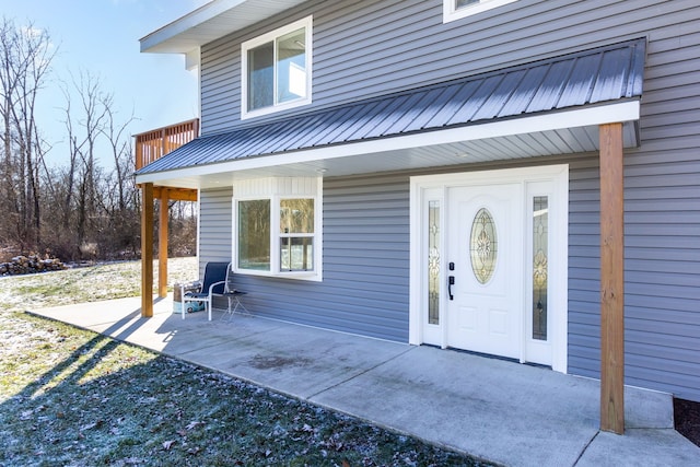 entrance to property with a balcony