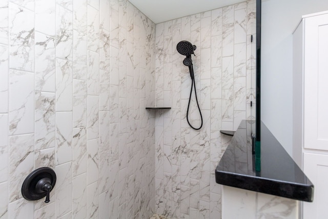 bathroom with tiled shower