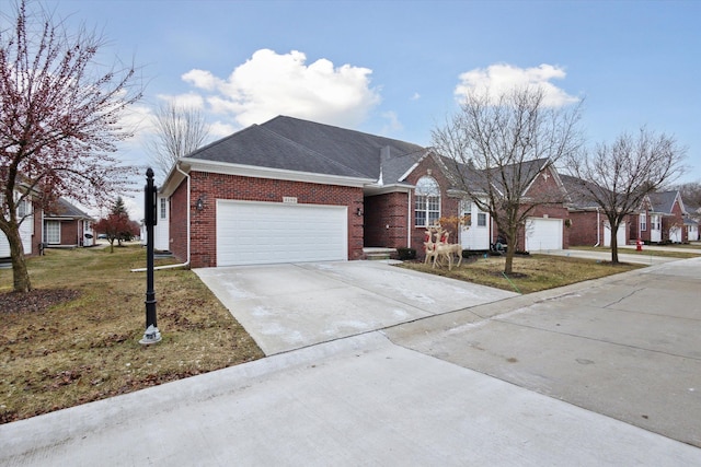 ranch-style home featuring a garage and a front lawn