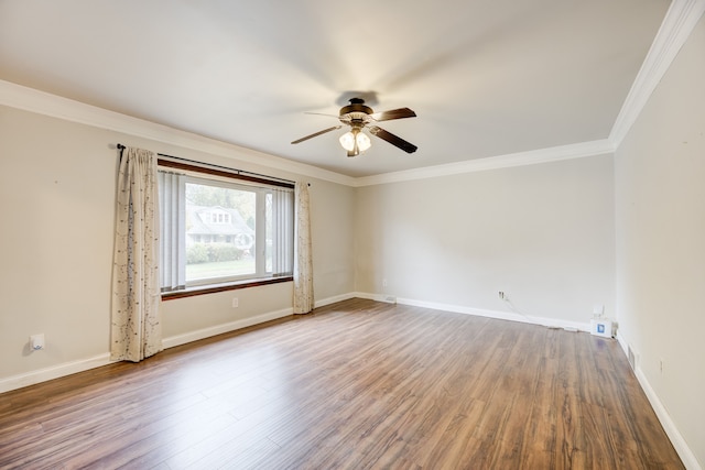 spare room with crown molding, ceiling fan, and wood-type flooring