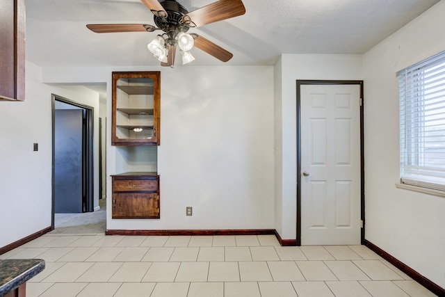 spare room with ceiling fan