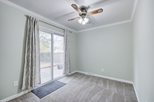 unfurnished room featuring carpet, ceiling fan, and crown molding