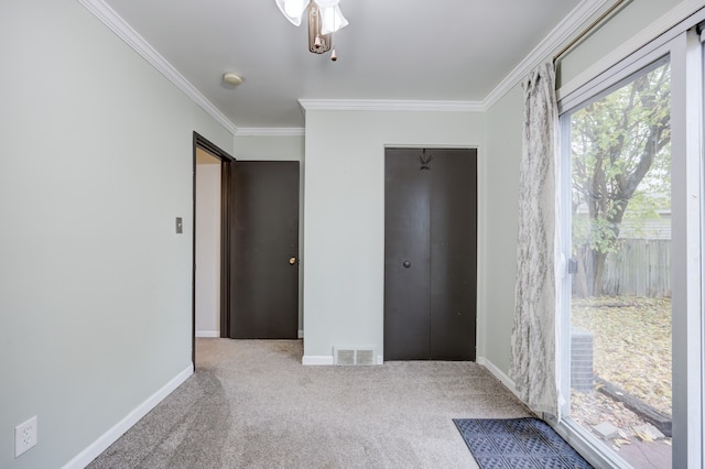 unfurnished bedroom with light colored carpet, a closet, and ornamental molding