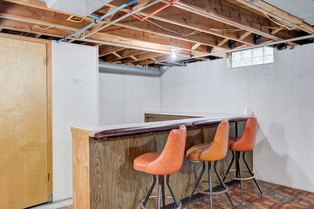 bar featuring dark parquet floors