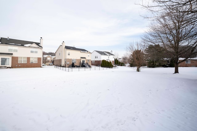 view of yard layered in snow