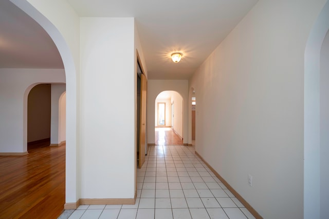 hallway with light tile patterned floors