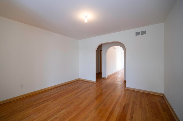 empty room with light hardwood / wood-style floors