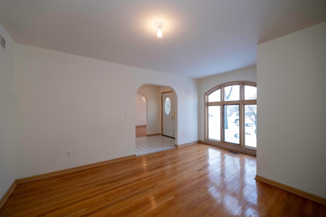 unfurnished room featuring light wood-type flooring