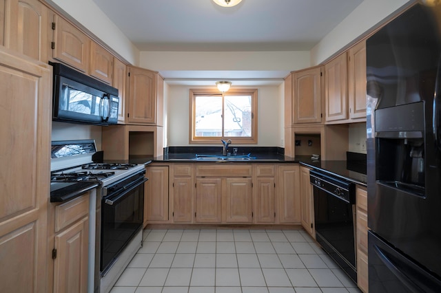 kitchen featuring light tile patterned flooring, light brown cabinetry, sink, and black appliances