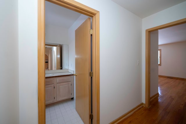 hall with light hardwood / wood-style floors