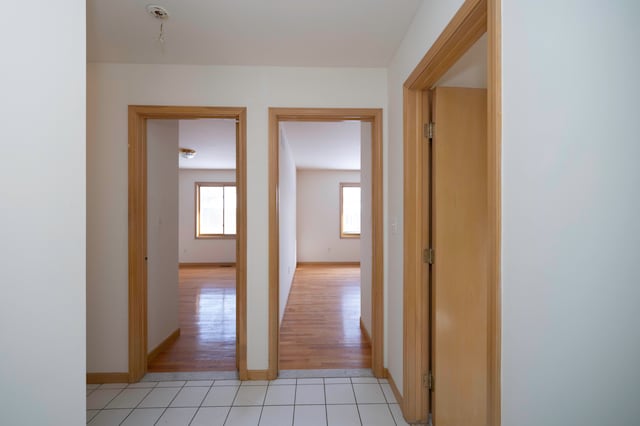 hall with light tile patterned flooring