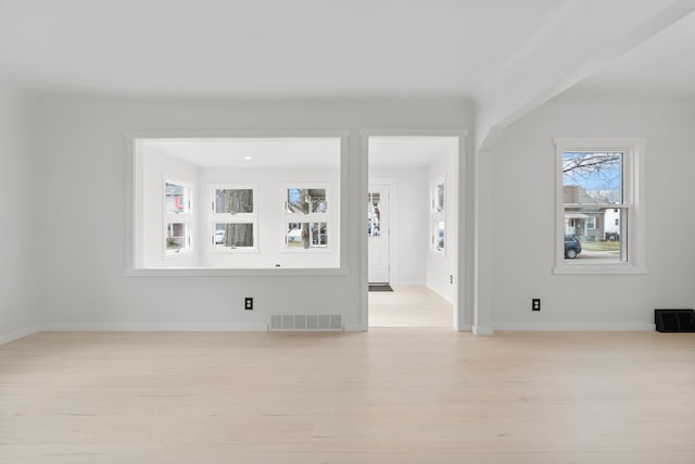 spare room featuring light hardwood / wood-style floors