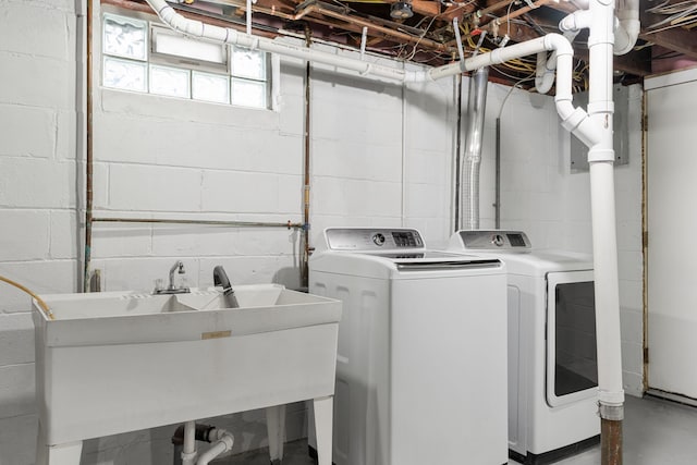 laundry area with washer and clothes dryer and sink