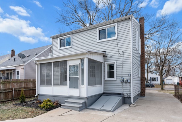 view of front of property with a sunroom