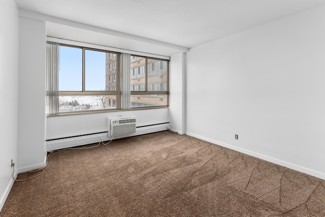 carpeted empty room featuring a baseboard heating unit