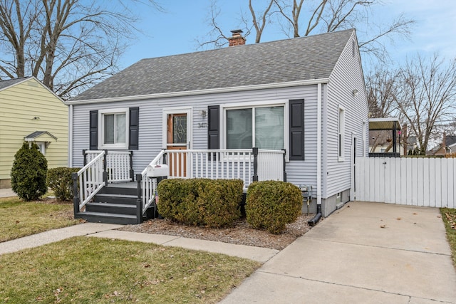 view of front facade with a front yard and a porch