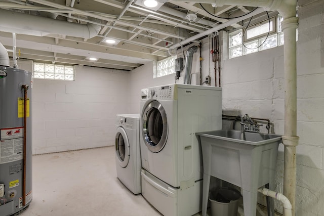 laundry room with separate washer and dryer and gas water heater