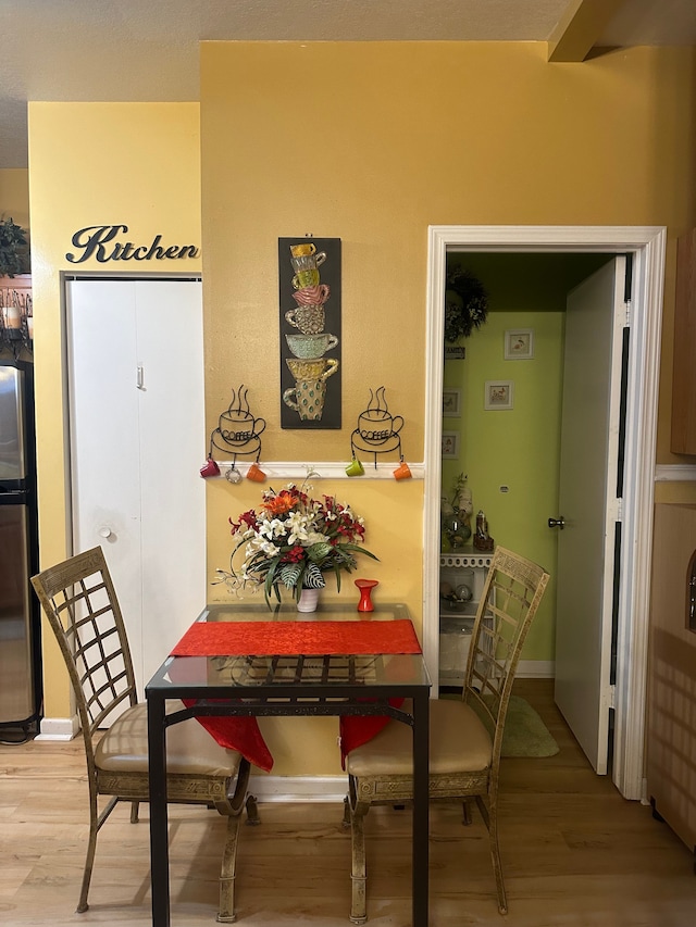 dining area featuring wood-type flooring