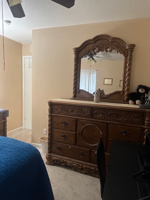 bedroom featuring ceiling fan and light colored carpet