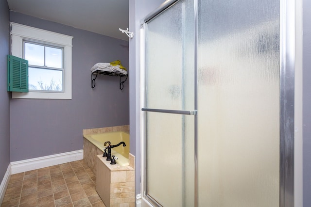 bathroom with separate shower and tub