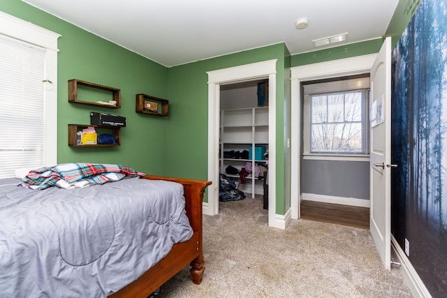 carpeted bedroom featuring a closet