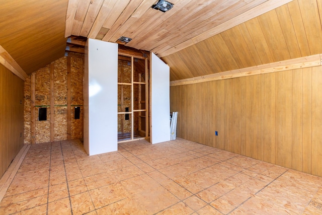 bonus room featuring lofted ceiling, wood walls, and wooden ceiling