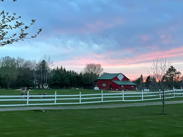 yard at dusk with a rural view