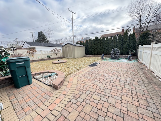 view of patio with a shed