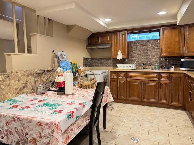 kitchen with decorative backsplash and sink