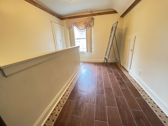 corridor featuring dark hardwood / wood-style flooring and ornamental molding